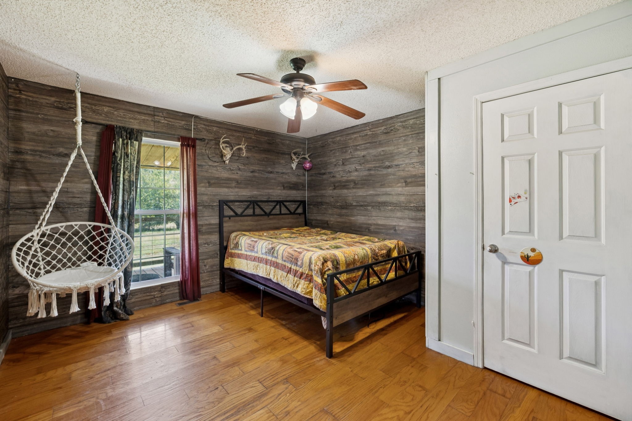 284 Duck Branch Road Fayetteville, TN 37334 - Photo 18 of 47 a bedroom with a bed a window and a chandelier