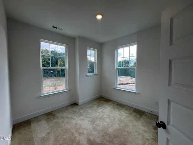 a kitchen with wooden cabinets and sink