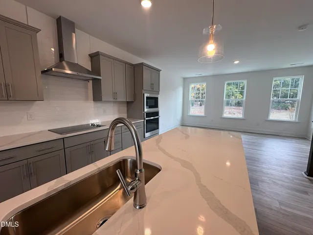 a picture of a room with a white wall and a large window