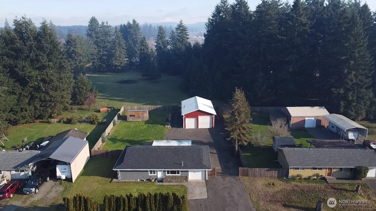 19140 Rosemary Street Southwest Rochester, WA 98579 - Photo 12 of 26 an aerial view of multiple houses with yard