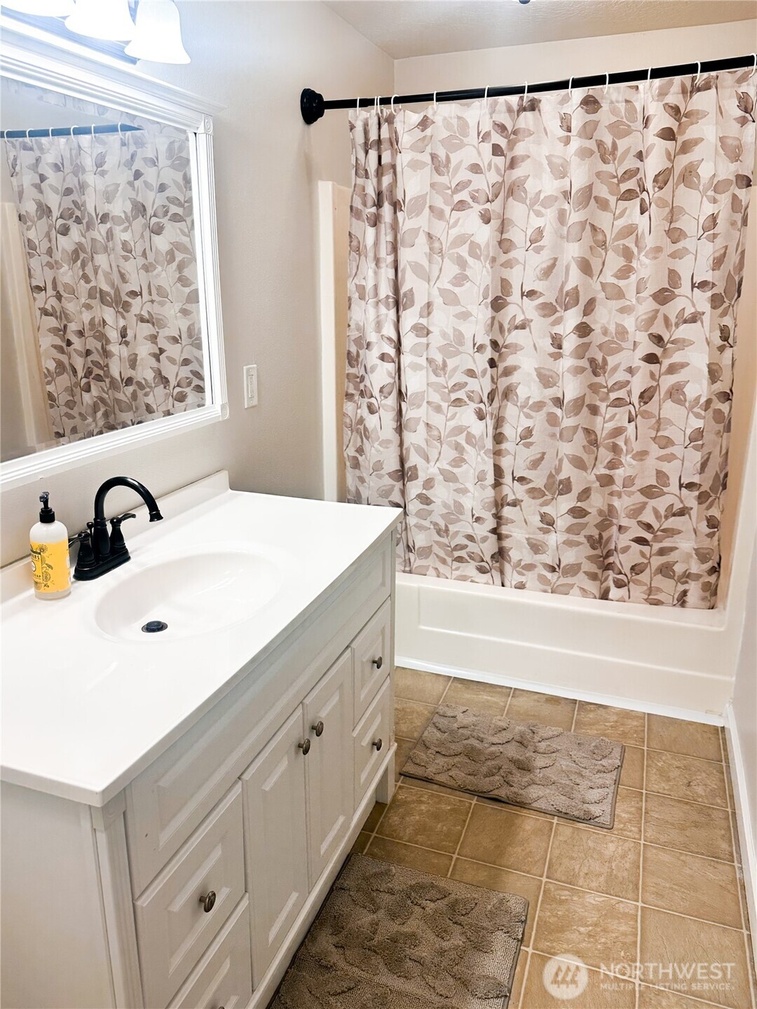 19140 Rosemary Street Southwest Rochester, WA 98579 - Photo 13 of 26 a bathroom with a sink and a bathtub