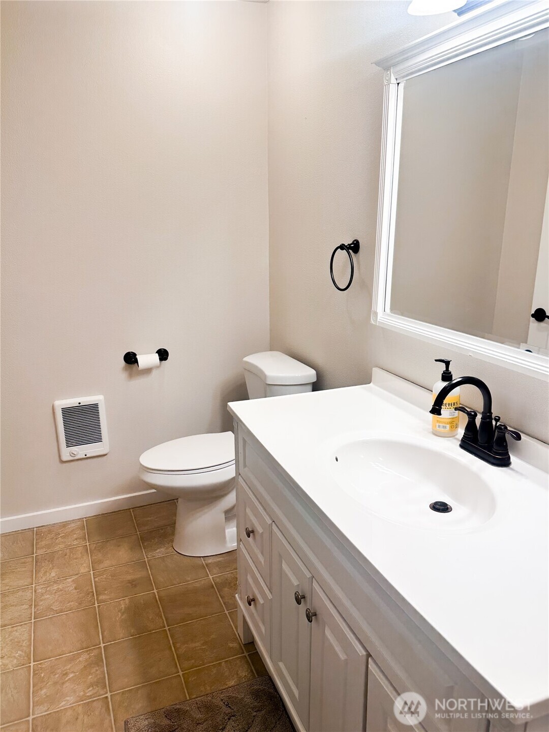 19140 Rosemary Street Southwest Rochester, WA 98579 - Photo 14 of 26 a bathroom with a toilet a sink and mirror