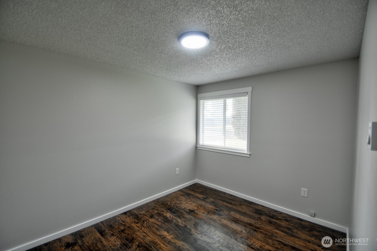 19140 Rosemary Street Southwest Rochester, WA 98579 - Photo 17 of 26 an empty room with a window