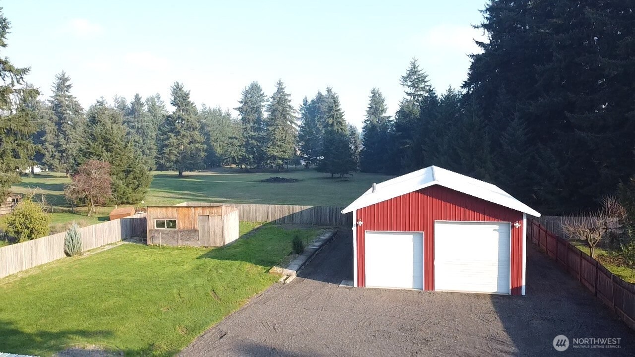 19140 Rosemary Street Southwest Rochester, WA 98579 - Photo 18 of 26 a front view of a house with a yard