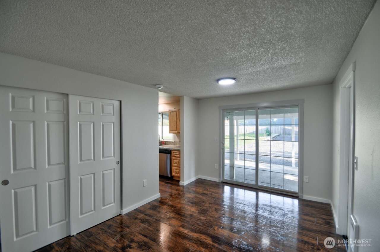 19140 Rosemary Street Southwest Rochester, WA 98579 - Photo 10 of 26 a view of empty room with wooden floor and fan