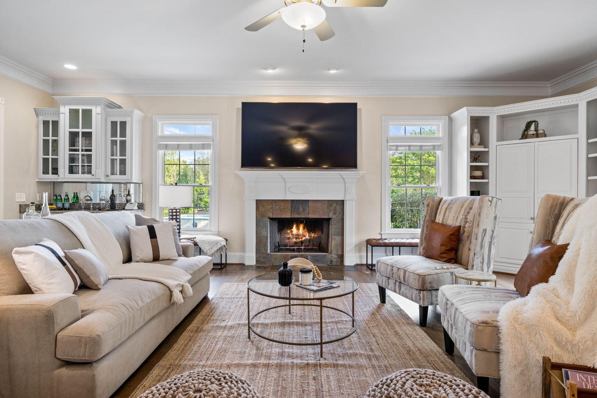 701 Sinclair Circle Brentwood, TN 37027 - Photo 23 of 70 a living room with furniture a flat screen tv and a fireplace