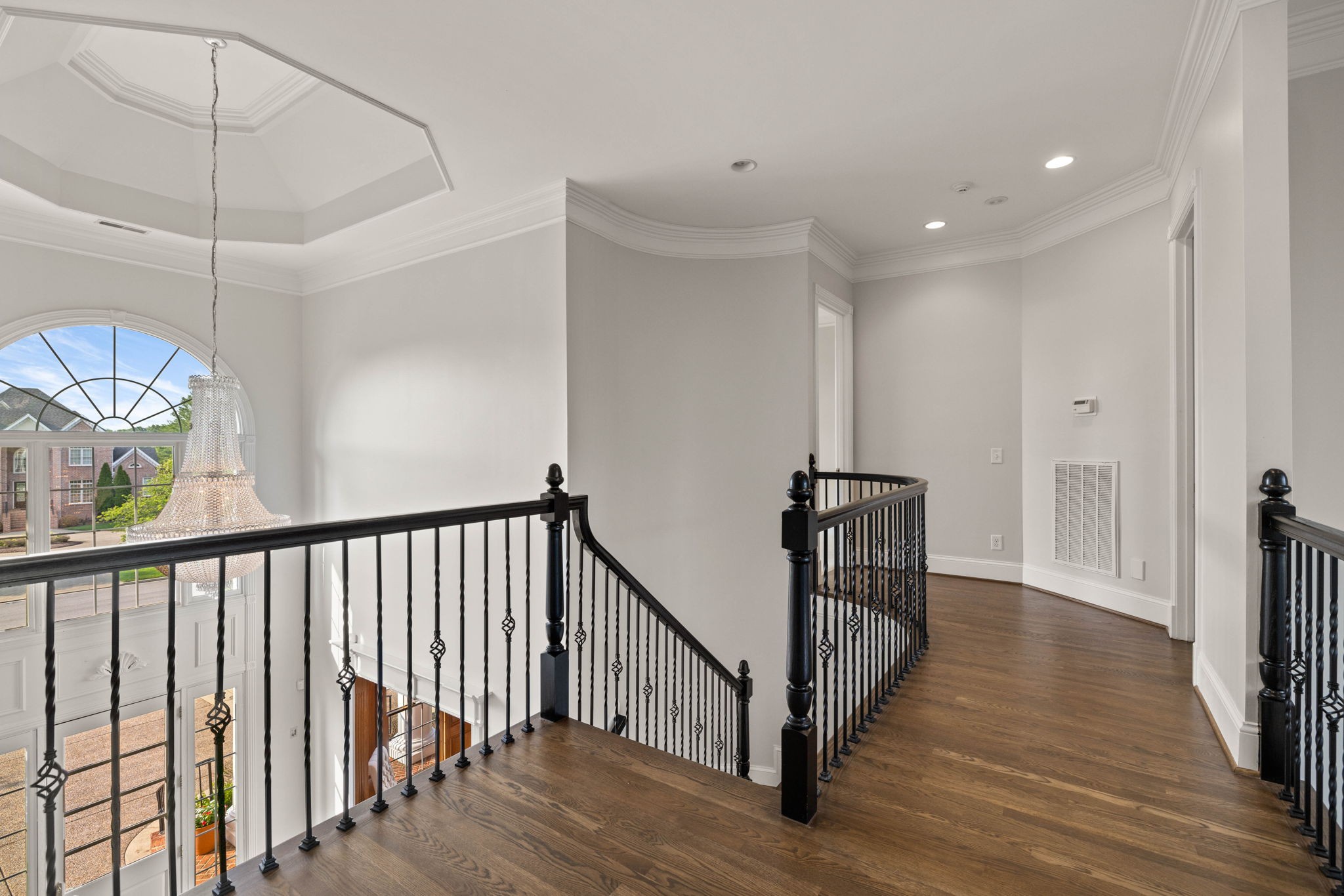 701 Sinclair Circle Brentwood, TN 37027 - Photo 40 of 70 a view of a hallway with wooden floor and staircase