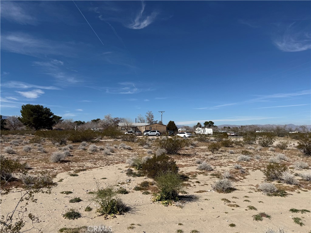 a view of a beach with a mountain in the background
