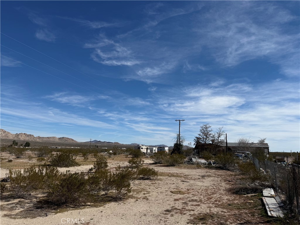 10248 Cavetto Road Lucerne Valley, CA 92356 - Photo 16 of 17 a view of a town with mountains in the background