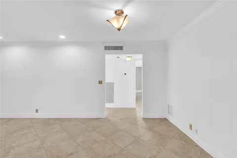 a view of a hallway with a window