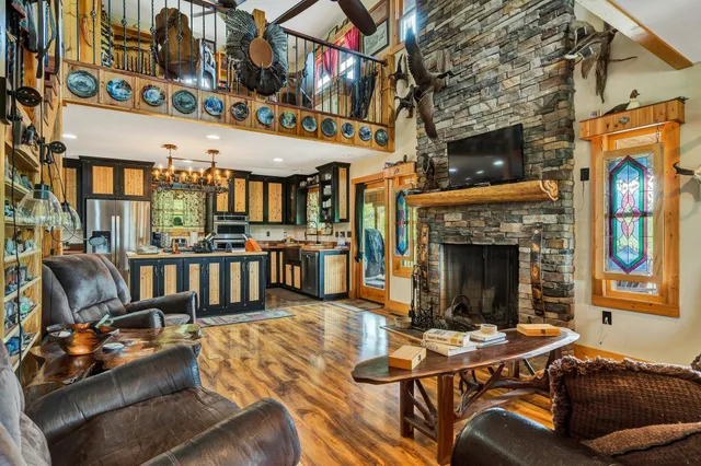 a view of a livingroom with furniture and a fireplace