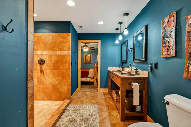 a bathroom with a shower and a sink