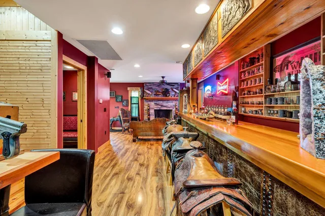 a living room filled with furniture and kitchen