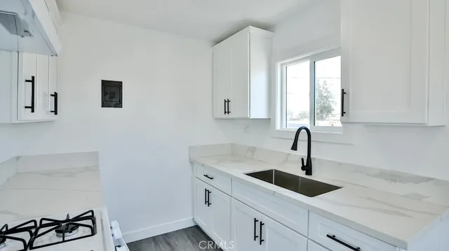 a kitchen with a sink and cabinets