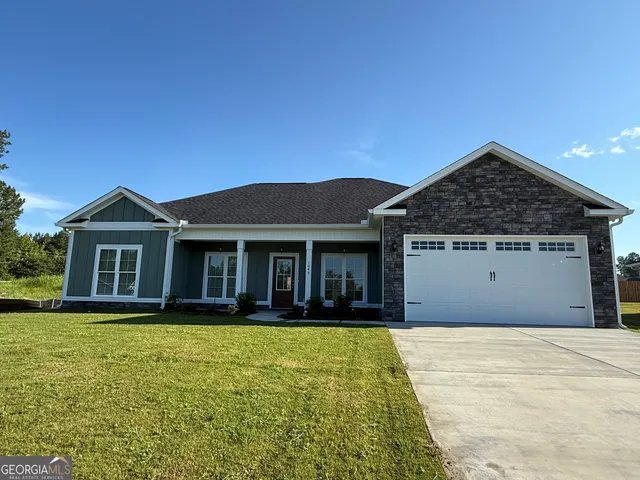 a front view of a house with yard