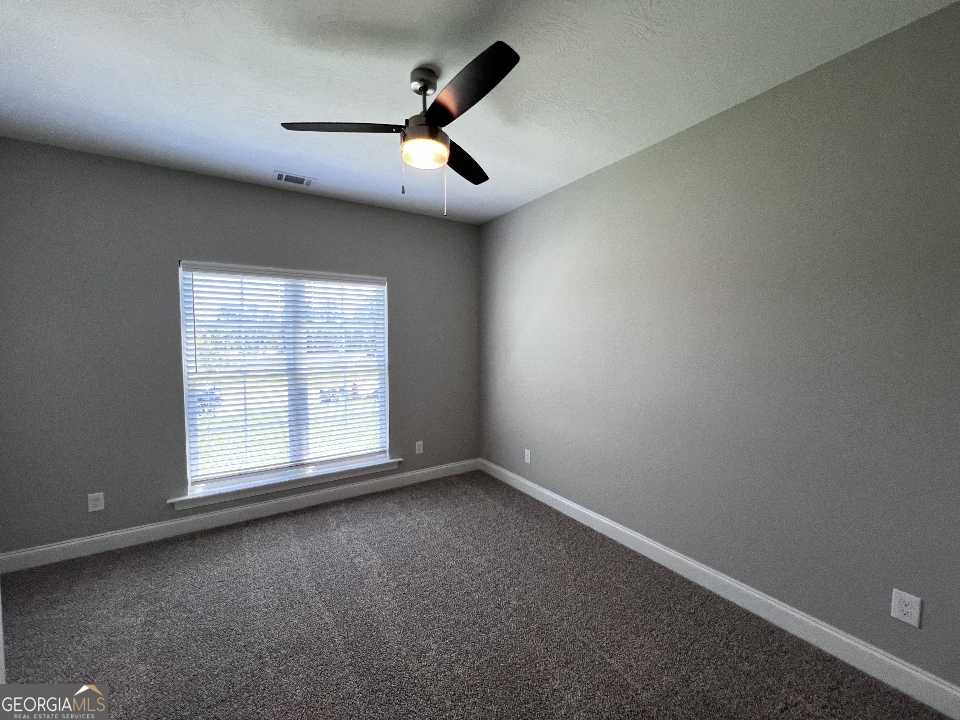 1045 Berkley Court Thomson, GA 30824 - Photo 21 of 32 an empty room with a window