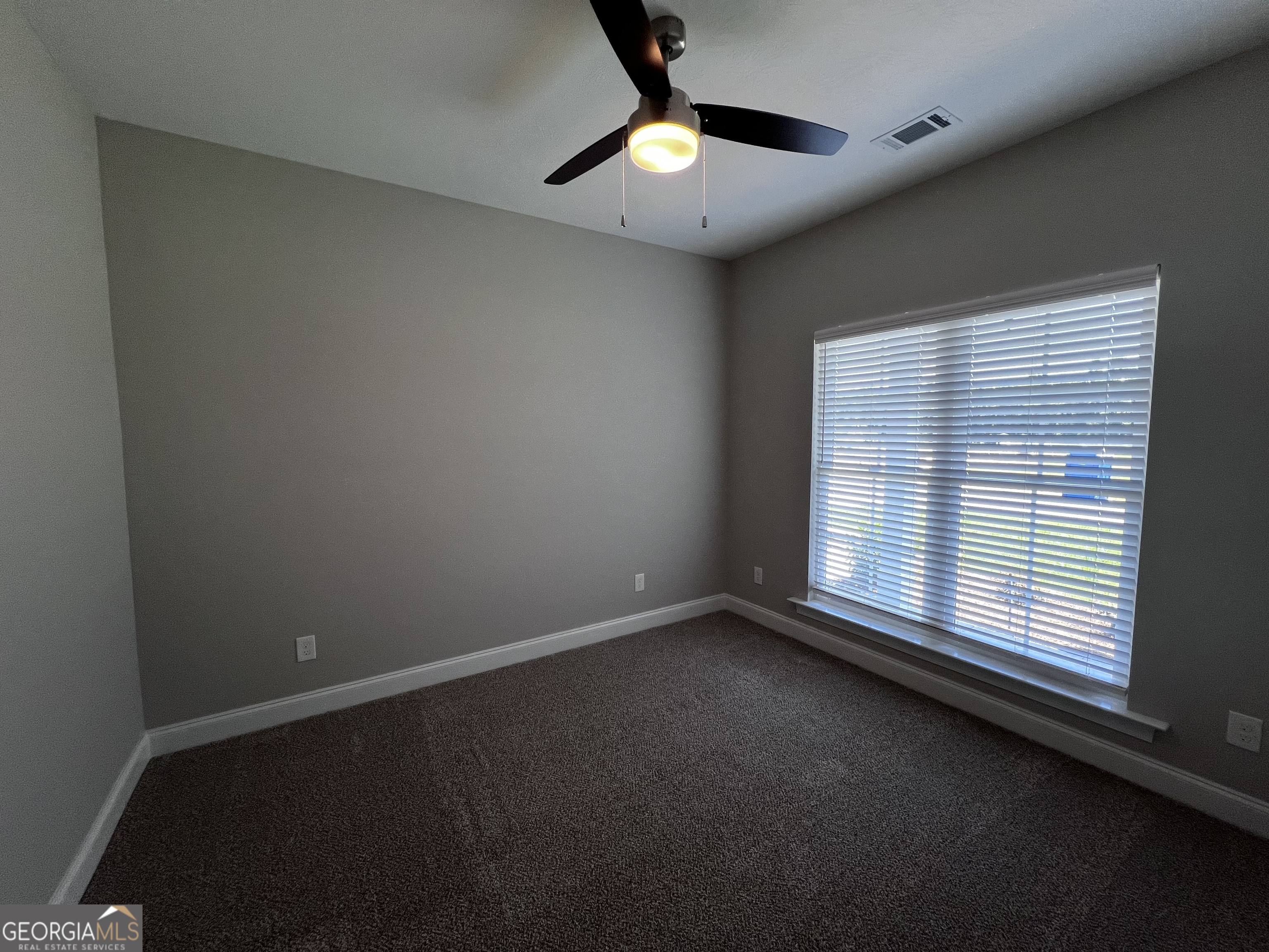 1045 Berkley Court Thomson, GA 30824 - Photo 25 of 32 an empty room with a window