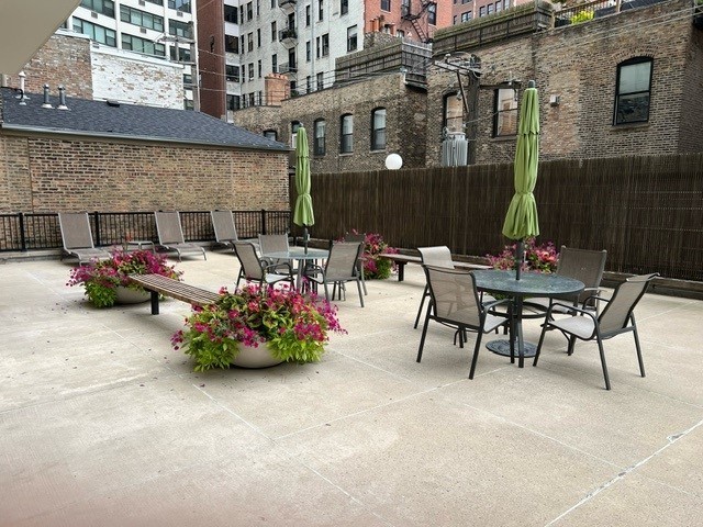 71 East Division Street, Unit 702 Chicago, IL 60611 - Photo 15 of 18 a table and chairs in front of a building