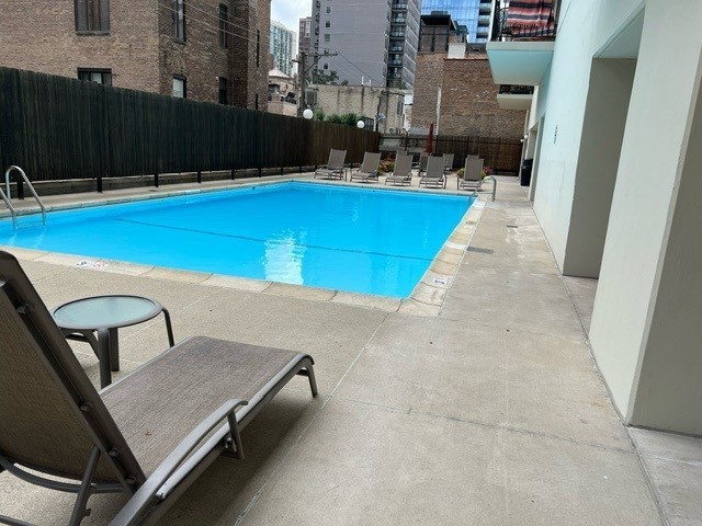 71 East Division Street, Unit 702 Chicago, IL 60611 - Photo 16 of 18 a view of a swimming pool with seating space