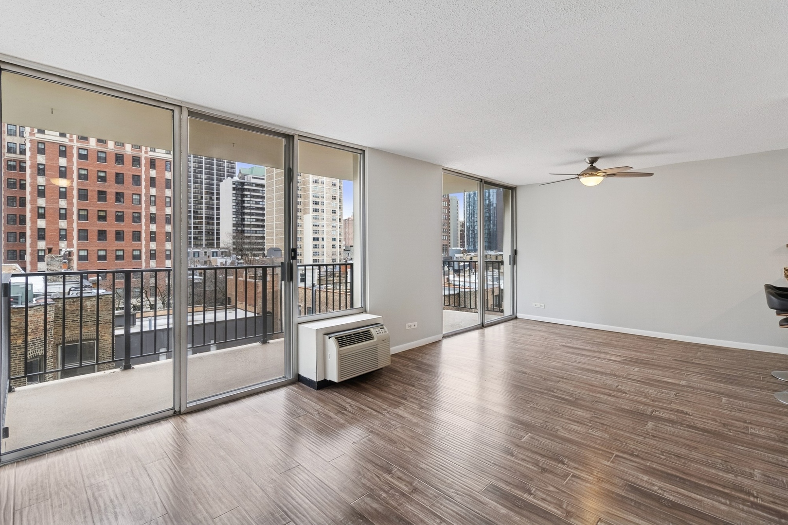 71 East Division Street, Unit 702 Chicago, IL 60611 - Photo 2 of 18 a view of livingroom with furniture and floor to ceiling window