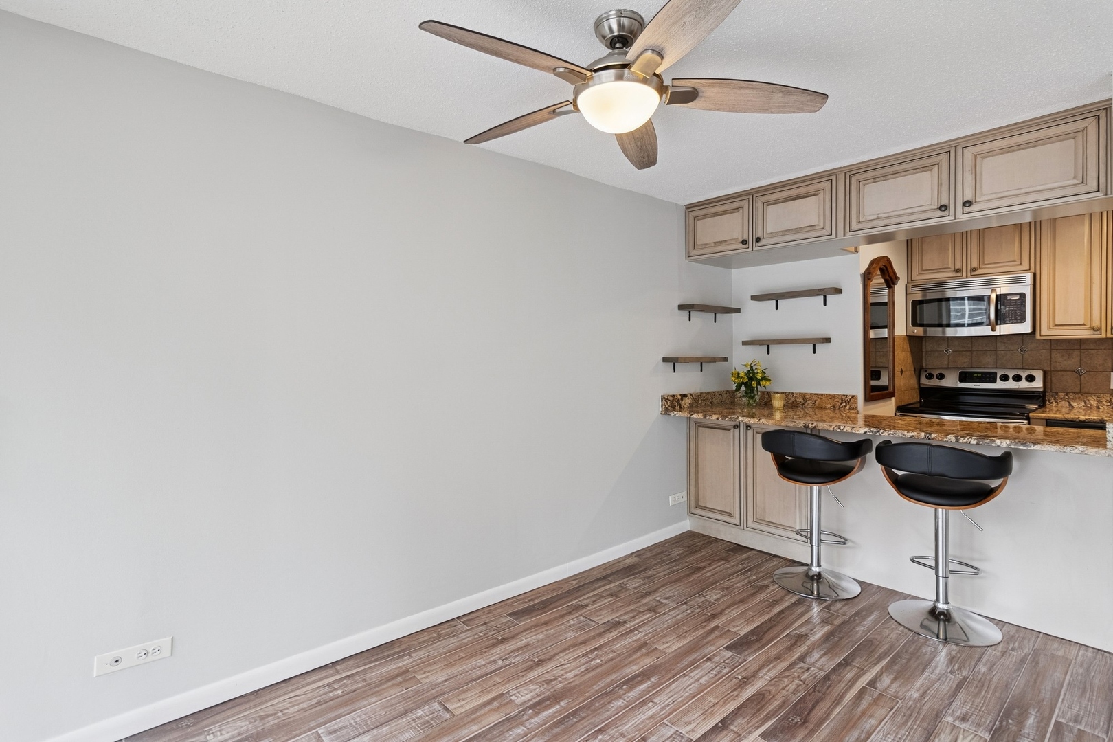 71 East Division Street, Unit 702 Chicago, IL 60611 - Photo 6 of 18 a view of a workspace with furniture and wooden floor