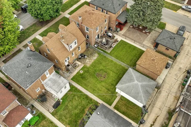 an aerial view of a house with a garden