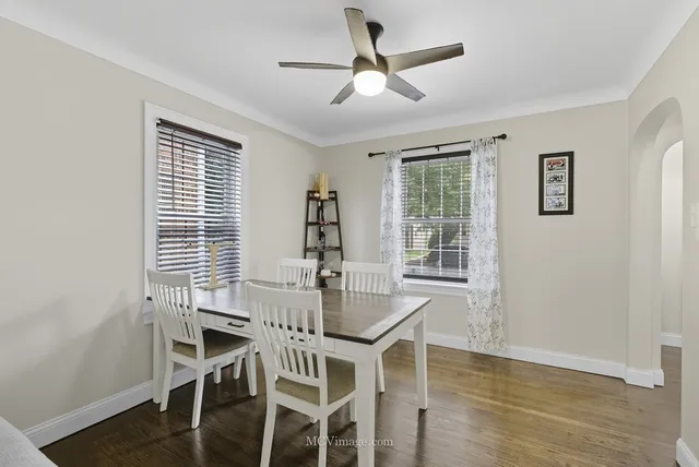 a dining room with furniture and window