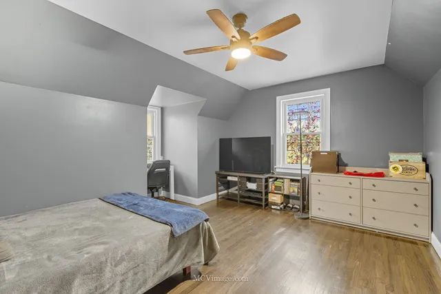 a bedroom with a workspace