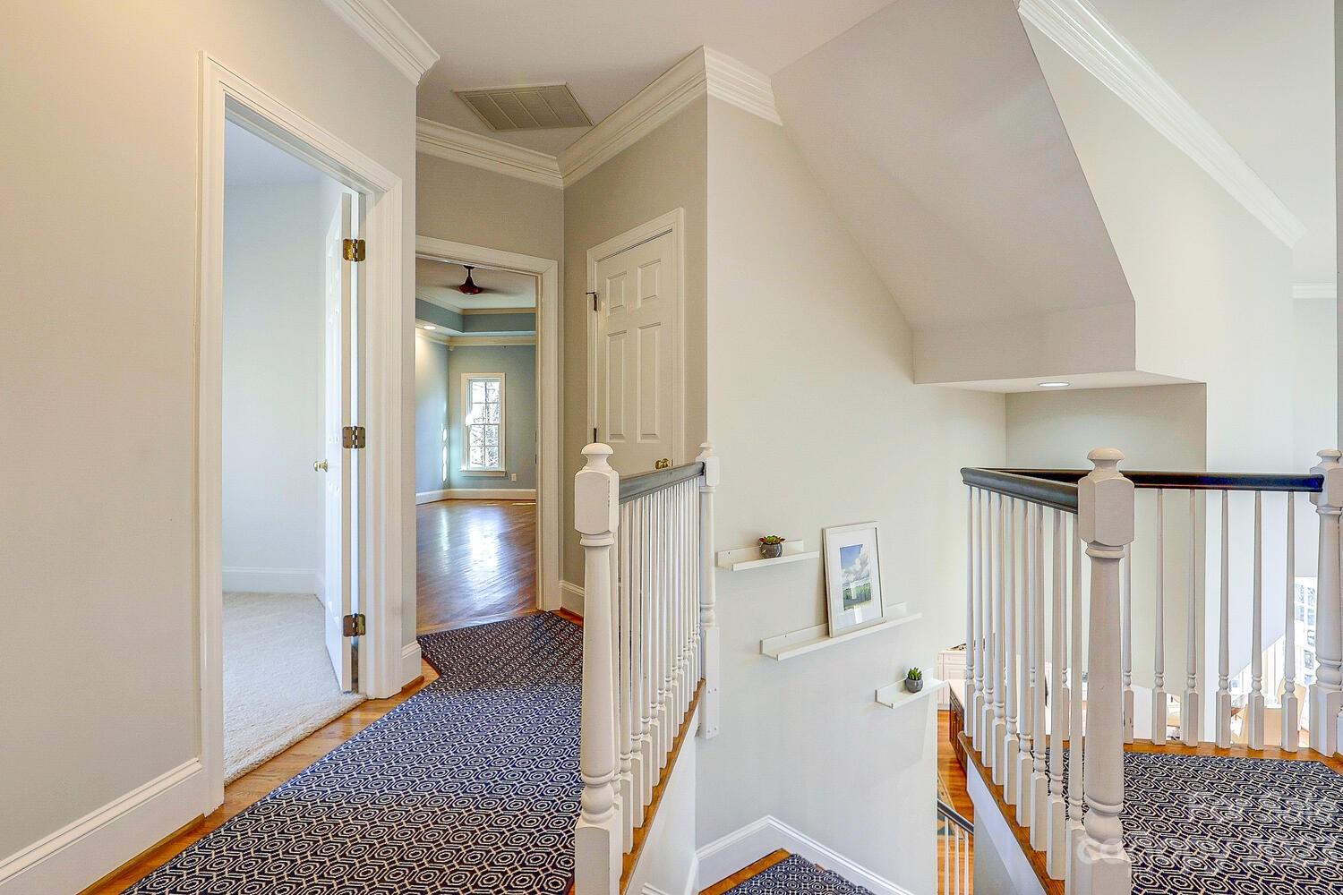 1732 Rutledge Avenue Charlotte, NC 28211 - Photo 17 of 30 a view of hallway with wooden floor and stairs