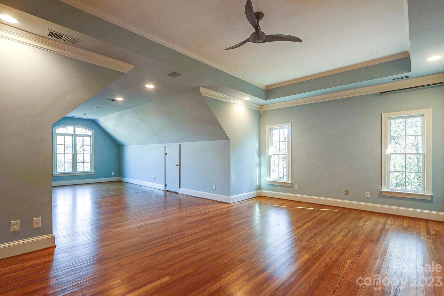 1732 Rutledge Avenue Charlotte, NC 28211 - Photo 18 of 30 a view of empty room with wooden floor and fan