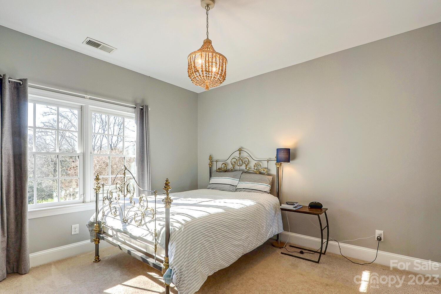 1732 Rutledge Avenue Charlotte, NC 28211 - Photo 23 of 30 a bedroom with a bed and a window