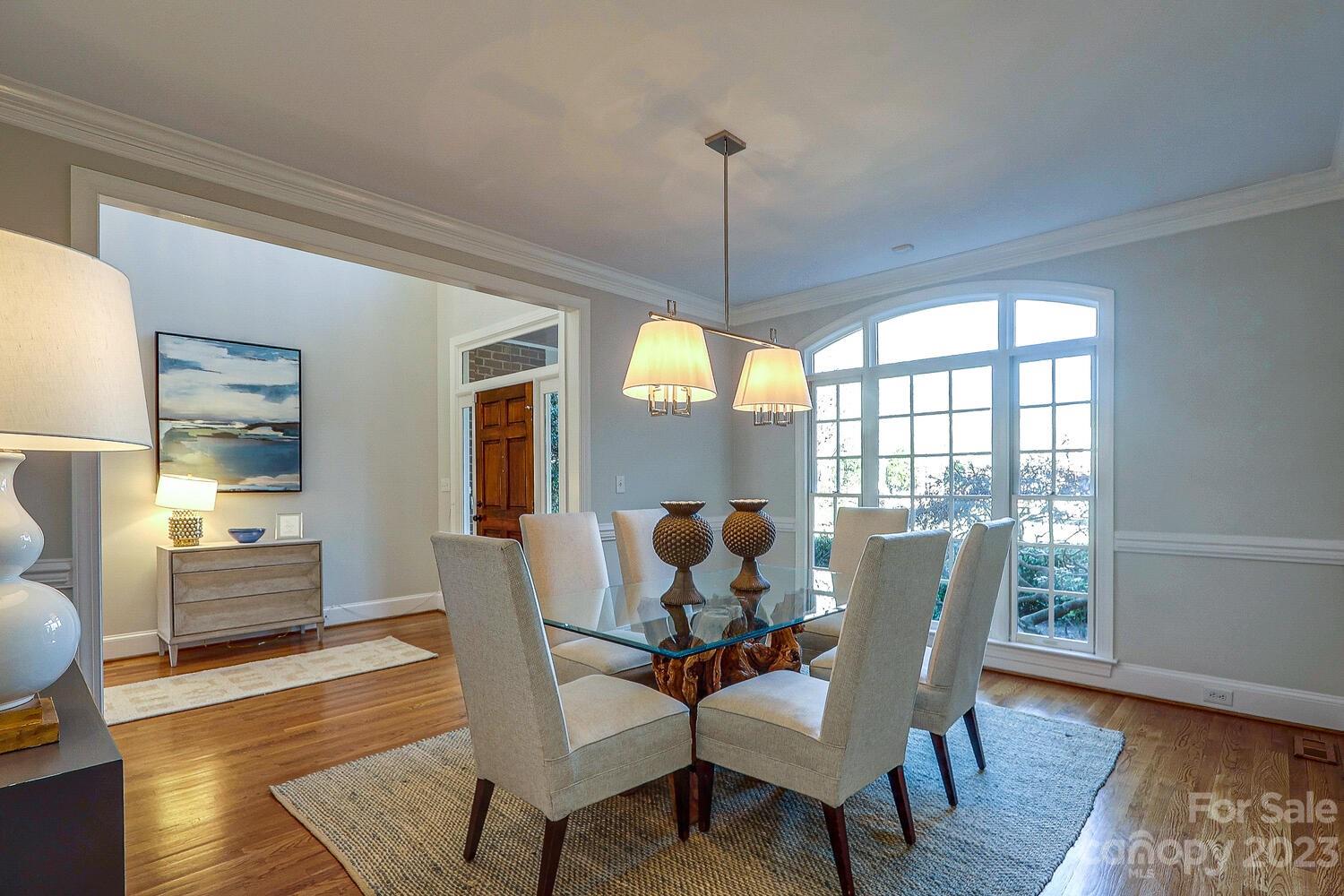 1732 Rutledge Avenue Charlotte, NC 28211 - Photo 3 of 30 a dining room with furniture a chandelier and wooden floor