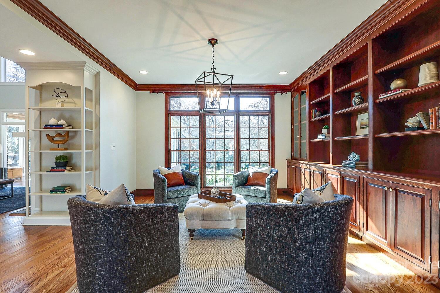 1732 Rutledge Avenue Charlotte, NC 28211 - Photo 5 of 30 a living room with furniture a bookshelf and a large window