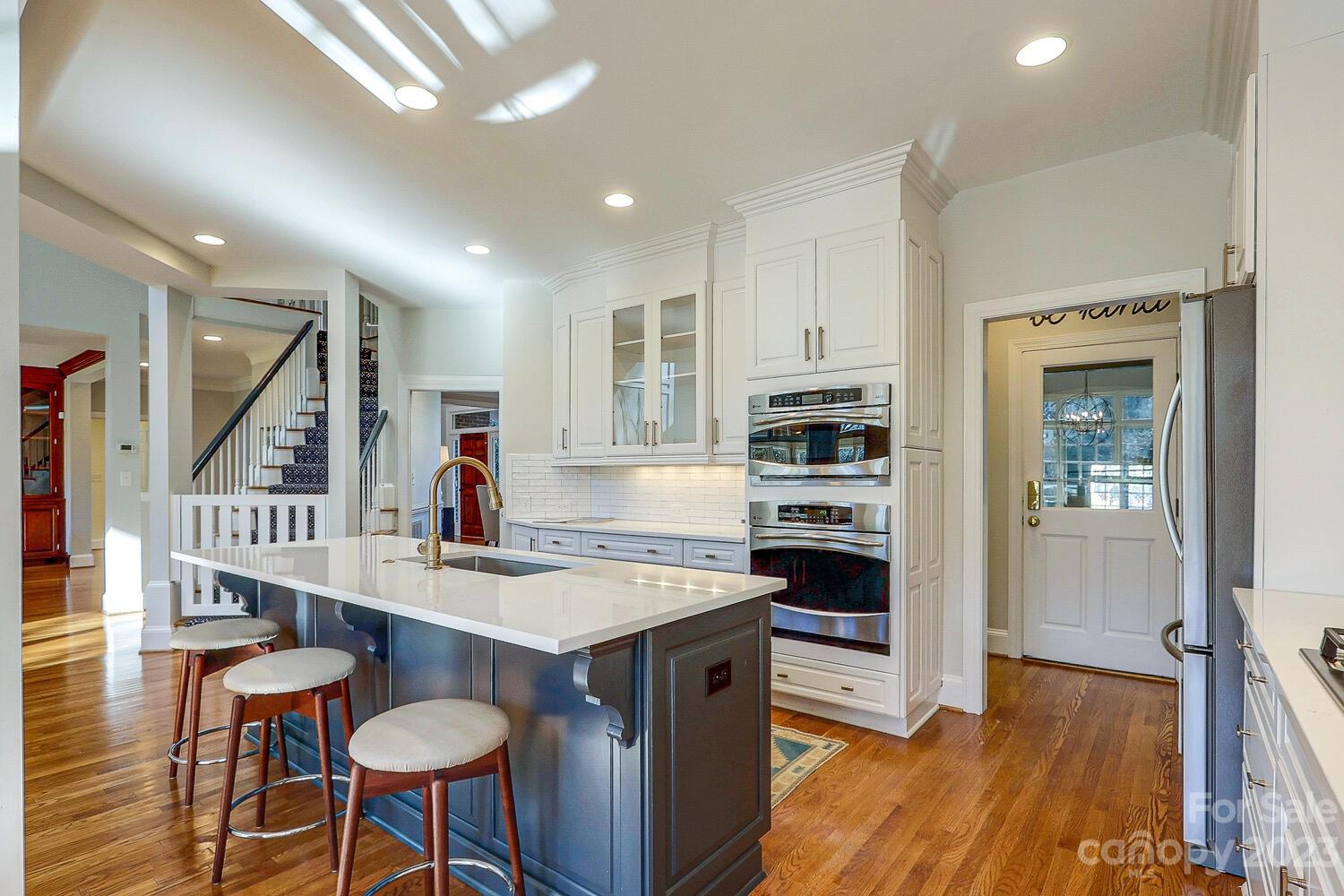 1732 Rutledge Avenue Charlotte, NC 28211 - Photo 10 of 30 a kitchen with stainless steel appliances granite countertop a refrigerator and a stove top oven