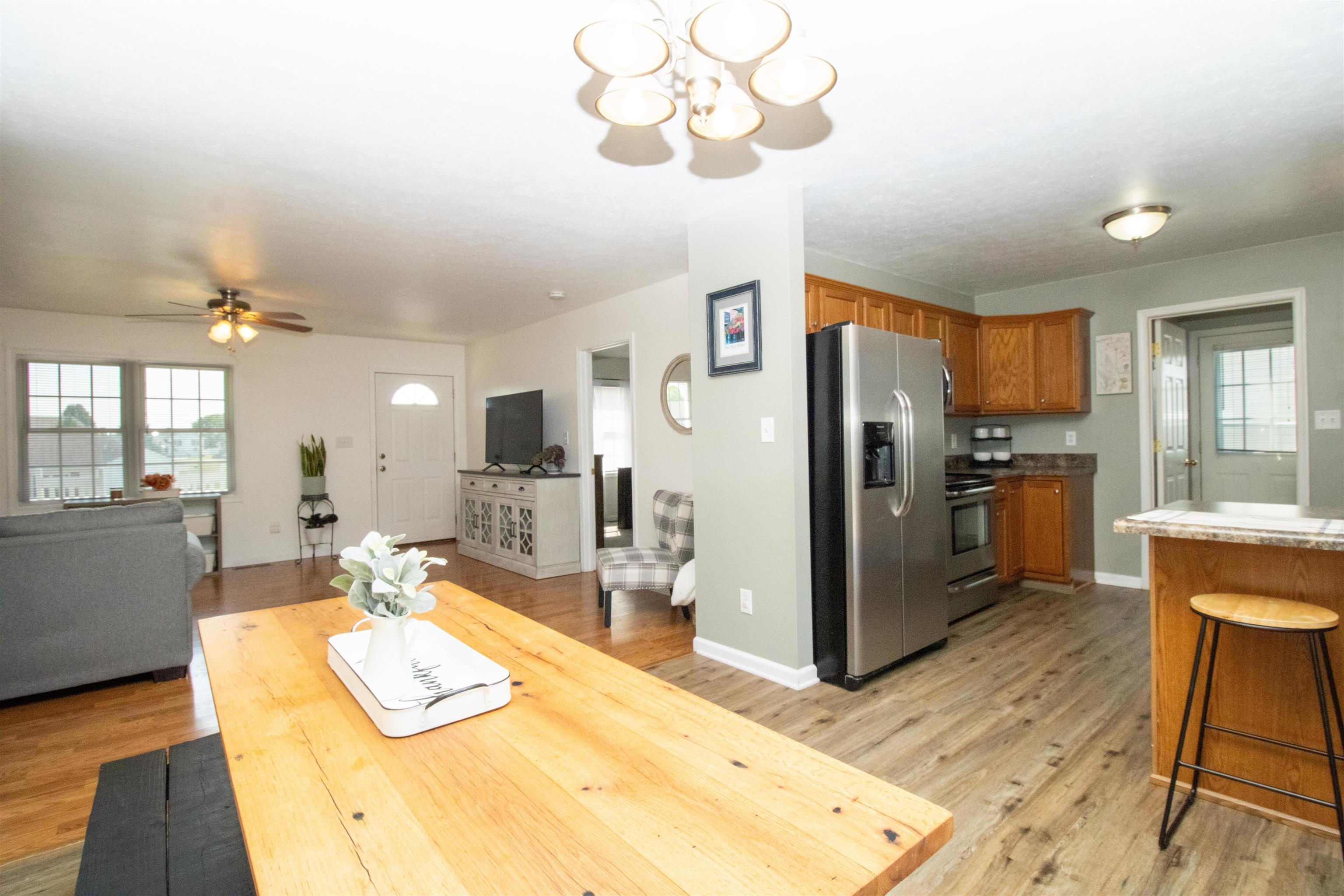 37 Danforth Drive Weyers Cave, VA 24486 - Photo 12 of 45 a kitchen with stainless steel appliances kitchen island granite countertop a refrigerator and microwave