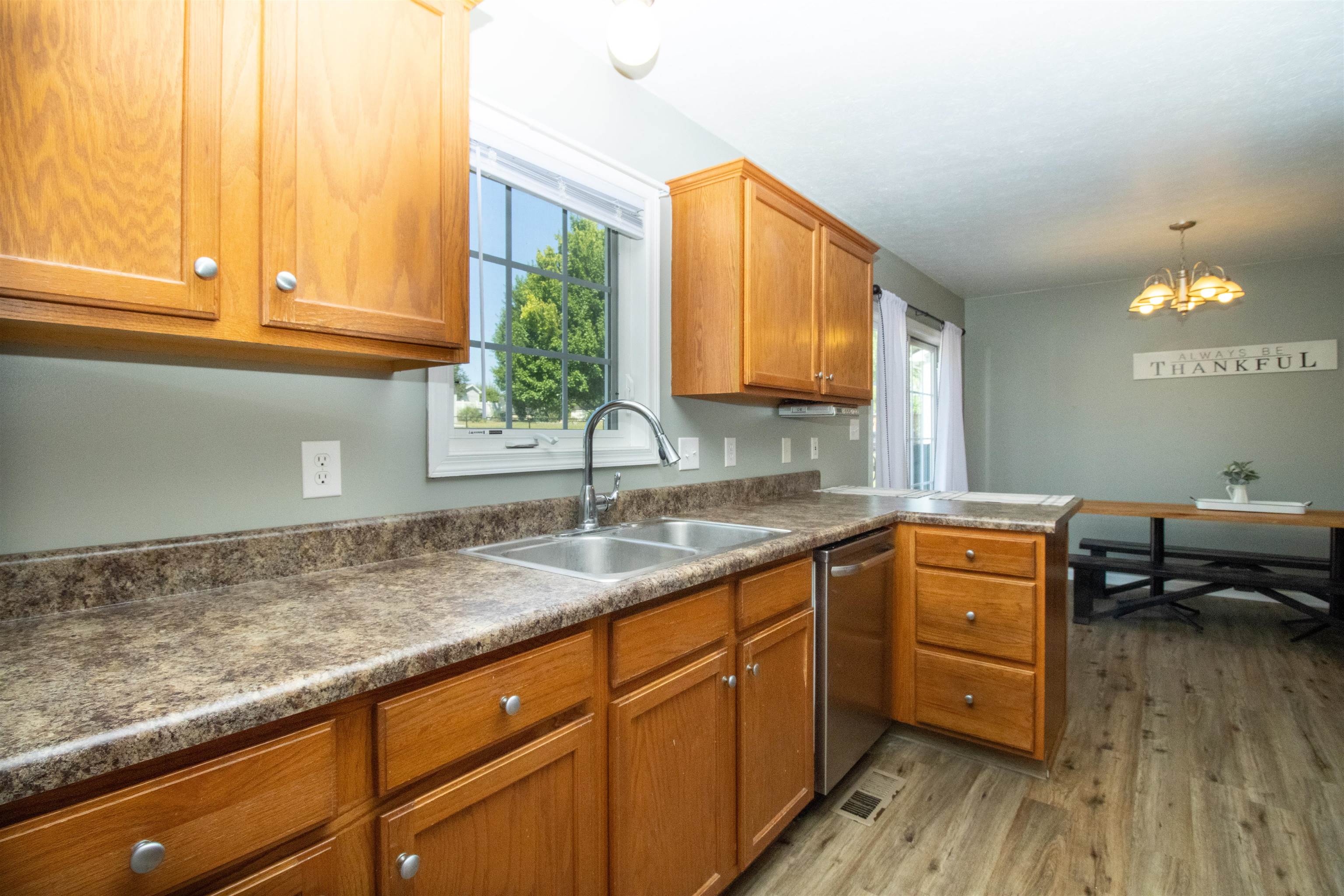 37 Danforth Drive Weyers Cave, VA 24486 - Photo 17 of 45 a kitchen with granite countertop a sink a window stainless steel appliances and cabinets