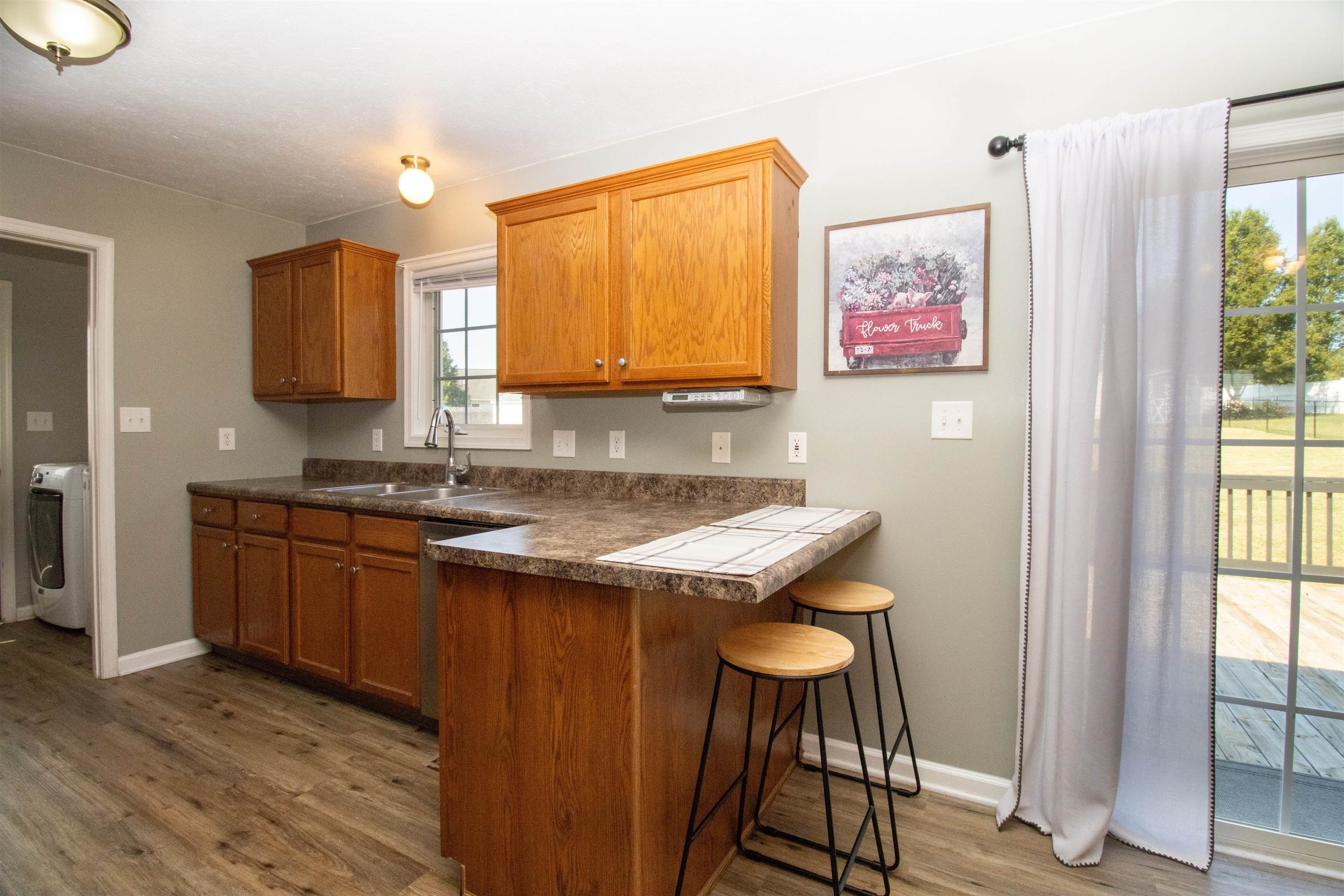 37 Danforth Drive Weyers Cave, VA 24486 - Photo 20 of 45 a room with a sink cabinets and wooden floor