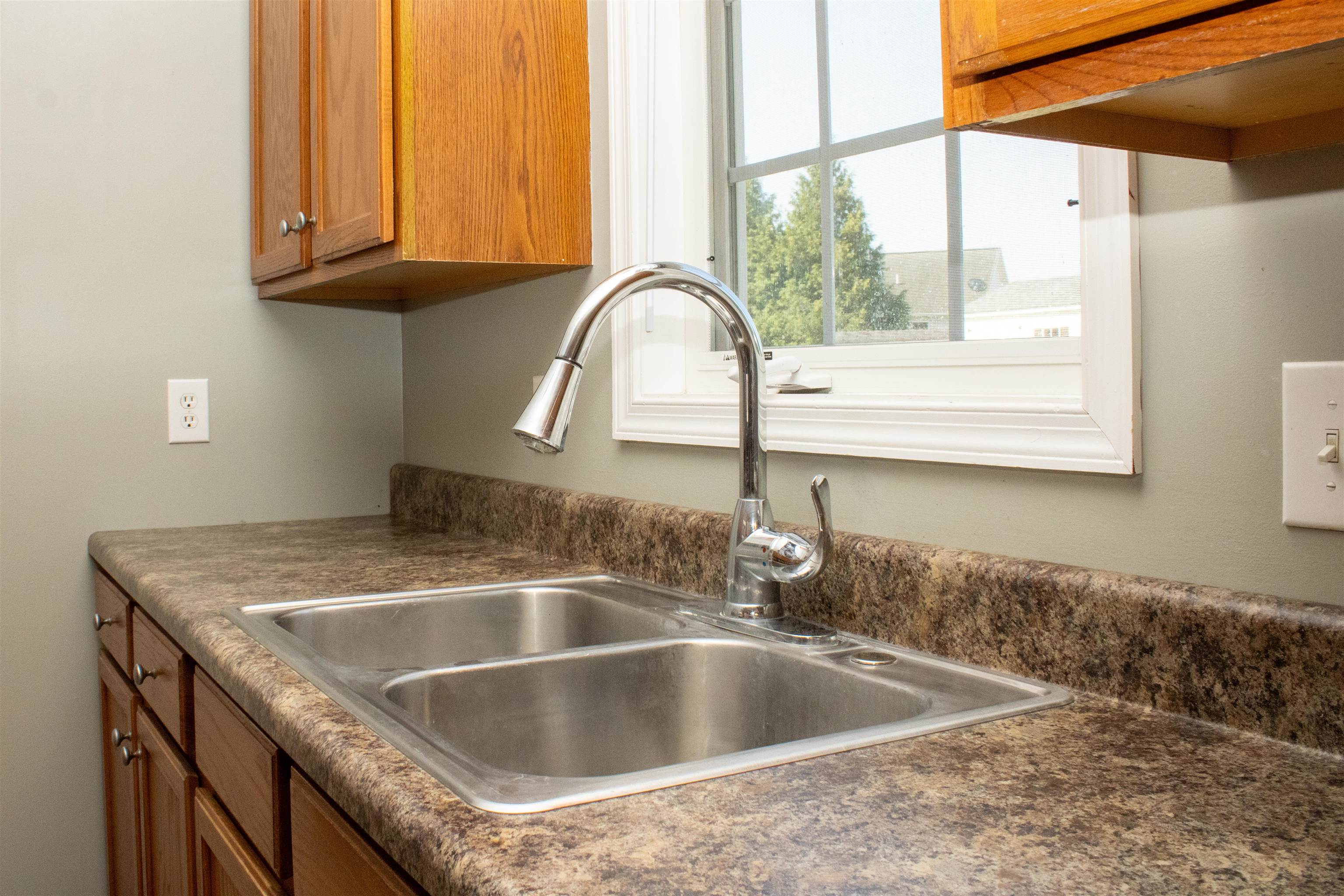 37 Danforth Drive Weyers Cave, VA 24486 - Photo 23 of 45 a kitchen with granite countertop a sink and a window
