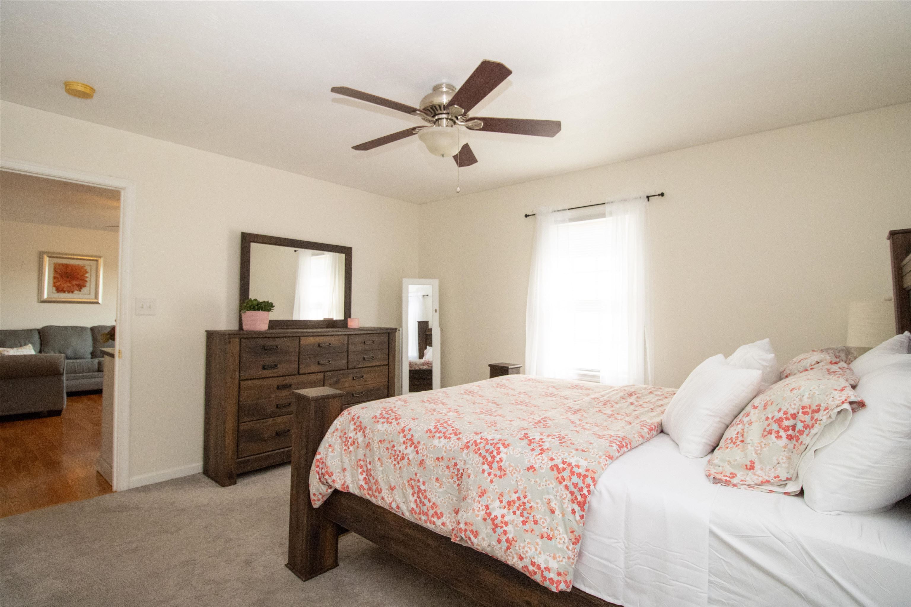 37 Danforth Drive Weyers Cave, VA 24486 - Photo 26 of 45 a bedroom with a bed and a chandelier