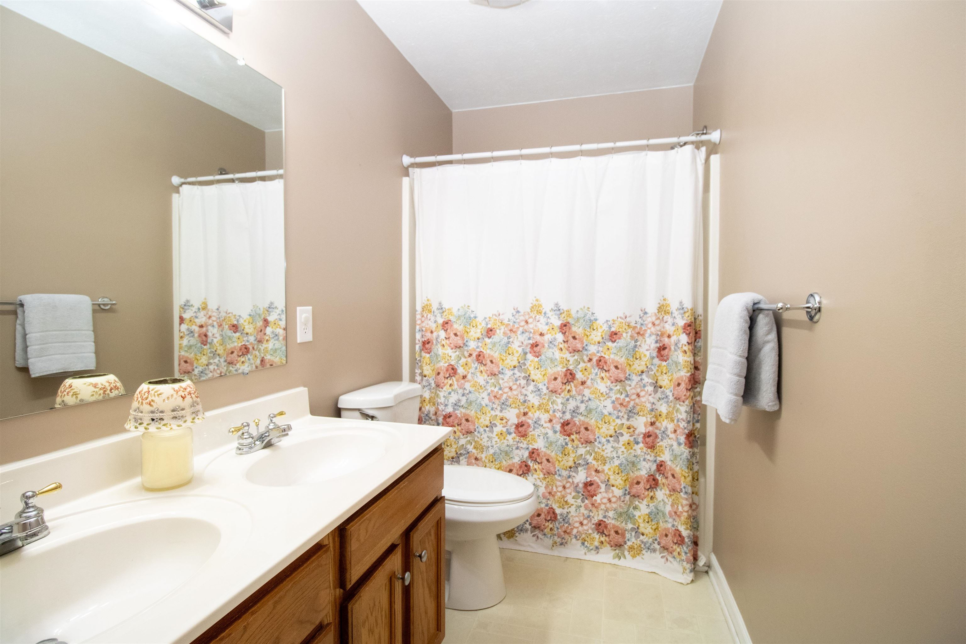 37 Danforth Drive Weyers Cave, VA 24486 - Photo 39 of 45 a bathroom with a sink a toilet and shower curtain