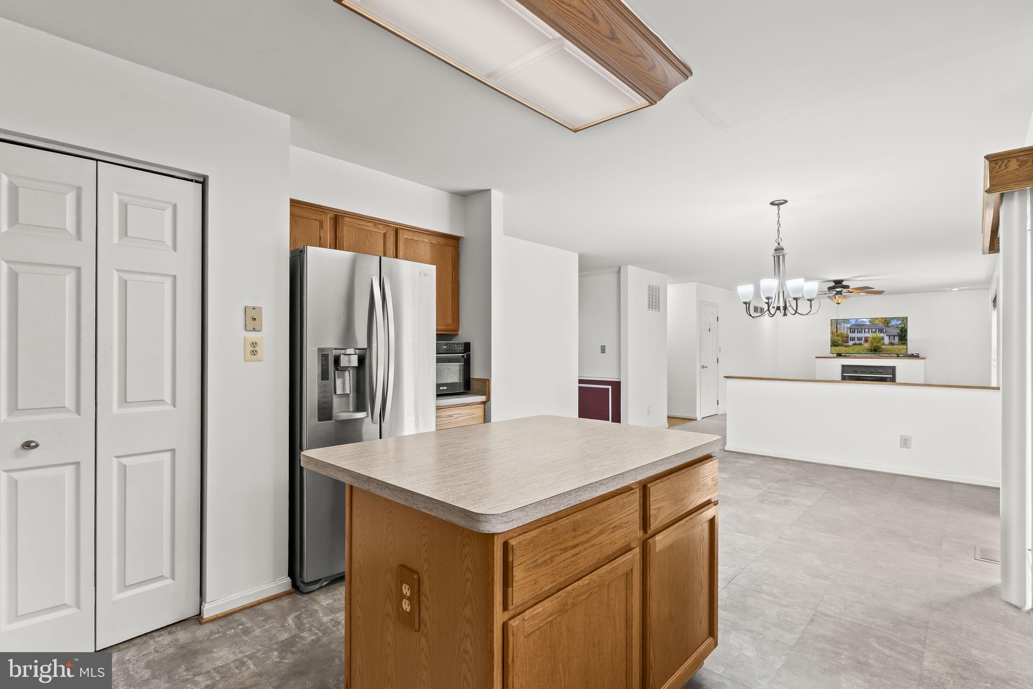 1425 Abbey Lane Huntingtown, MD 20639 - Photo 17 of 42 a view of kitchen with cabinets and refrigerator