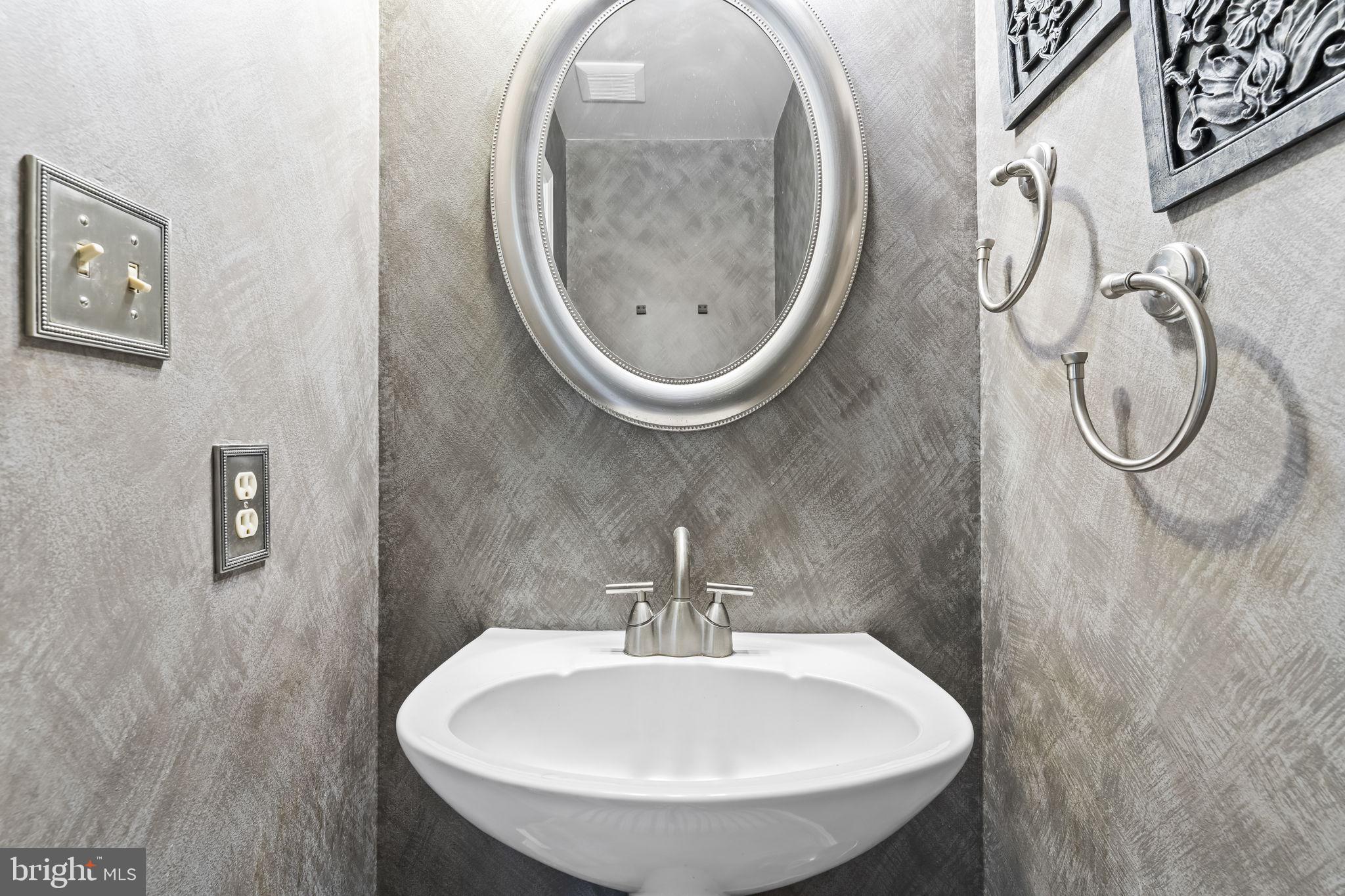 1425 Abbey Lane Huntingtown, MD 20639 - Photo 23 of 42 a bathroom with a sink and a mirror