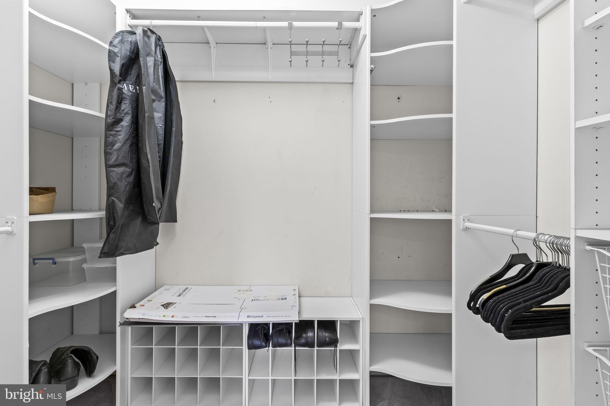 1425 Abbey Lane Huntingtown, MD 20639 - Photo 26 of 42 a view of walk in closet with clothes and shoes