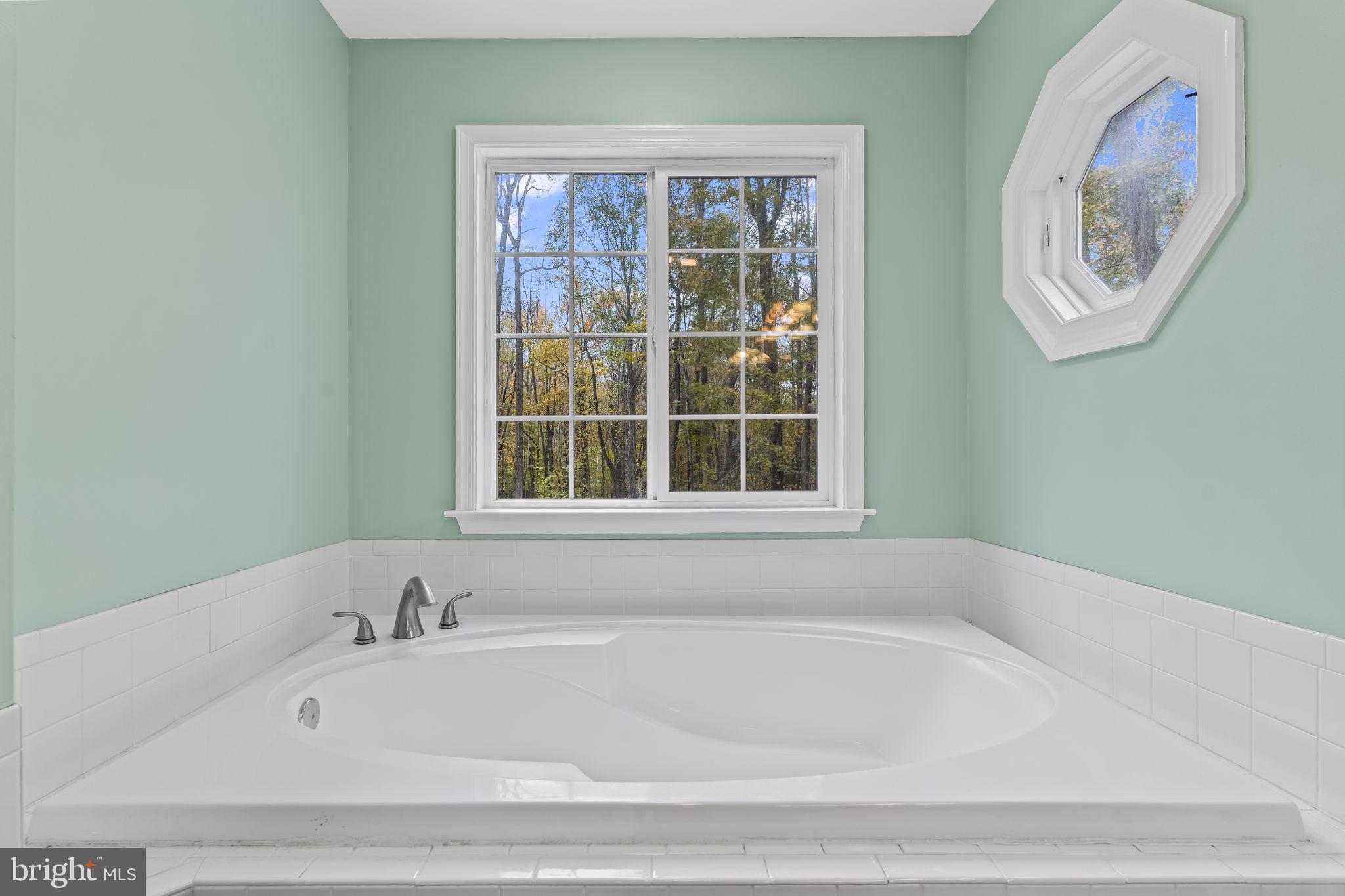 1425 Abbey Lane Huntingtown, MD 20639 - Photo 28 of 42 a white bath tub sitting next to a window