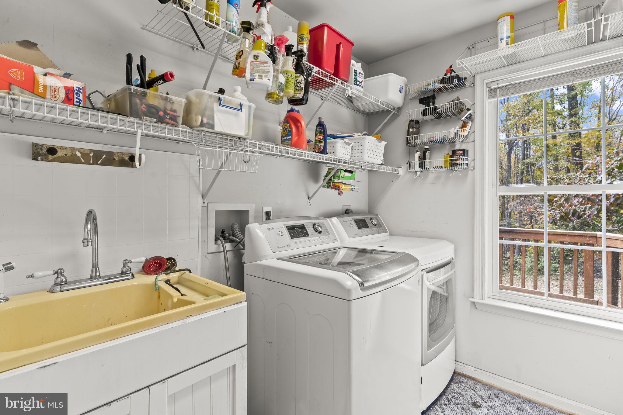 1425 Abbey Lane Huntingtown, MD 20639 - Photo 34 of 42 a utility room with dryer and washer