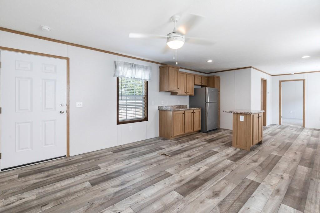 321 Beallsville Road Bentleyville, PA 15314 - Photo 7 of 21 a view of a kitchen with a sink dishwasher cabinets and wooden floor