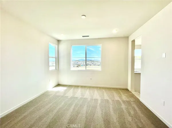 an empty room with a bathroom