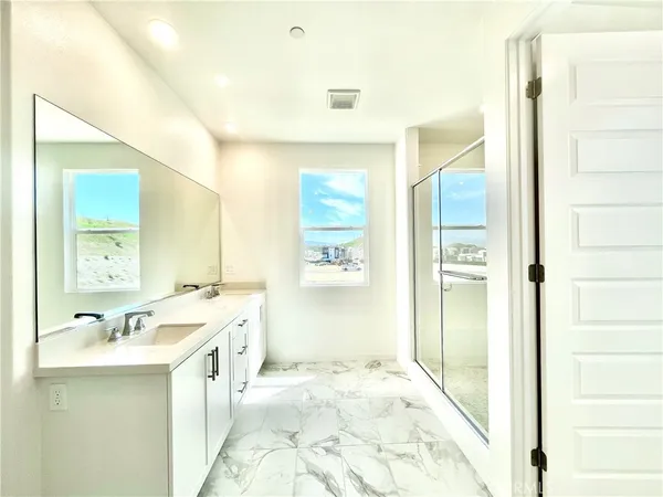 a bathroom with a shower and a tub