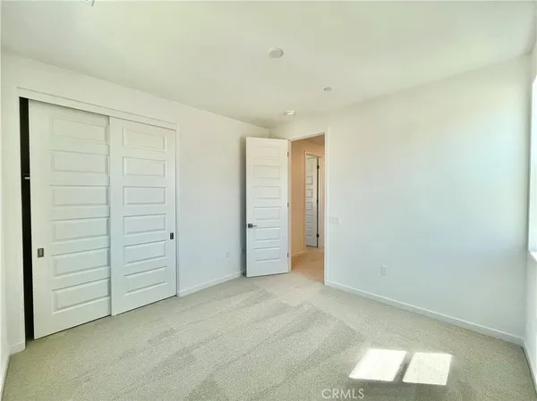 a spacious bathroom with a granite countertop sink a toilet and a bathtub