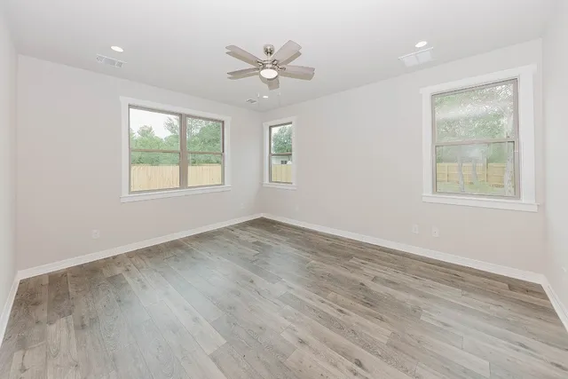 a spacious bathroom with a double vanity sink mirror and double